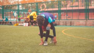 man on playing field during daytime