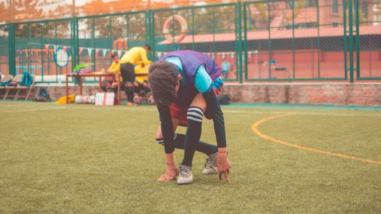 man on playing field during daytime