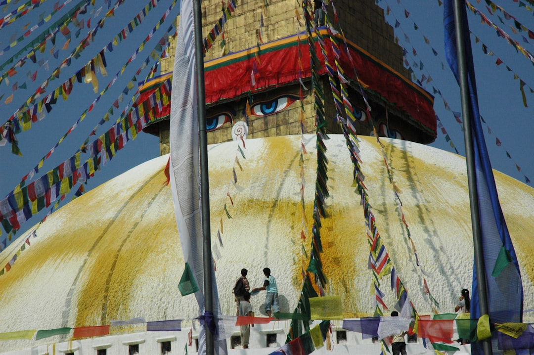 people beside building during day