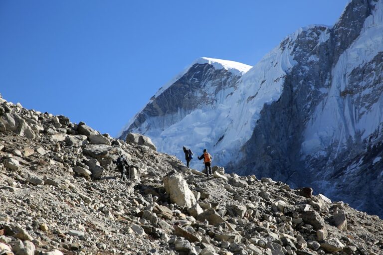 Responsible Tourism Initiatives in Kathmandu β Travel Guide to Kathmandu 1 person in black jacket and black pants standing on rocky mountain during daytime