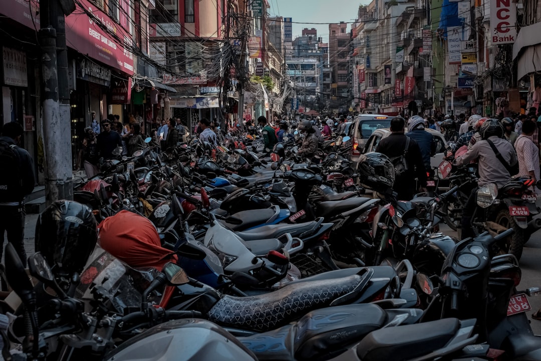 people riding motorcycle on road during daytime