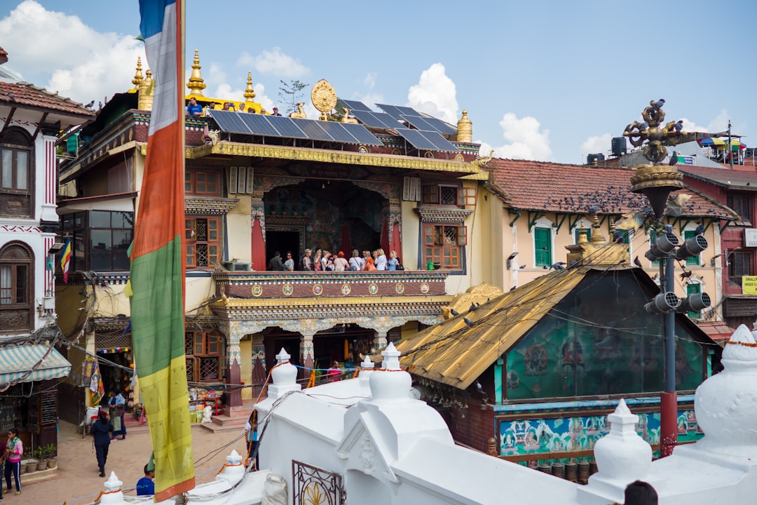 brown and white temple under blue sky during daytime