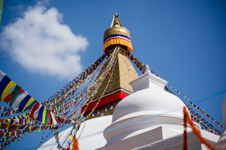 white yellow and blue concrete building under blue sky during daytime
