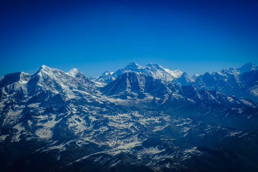 snow covered mountain under blue sky during daytime