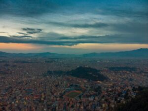 aerial view of city under cloudy sky during daytime
