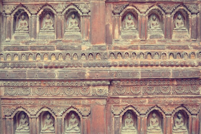 Best Local Experience Itinerary in Kathmandu β Travel Guide to Kathmandu 1 a stone wall with carvings of buddhas on it