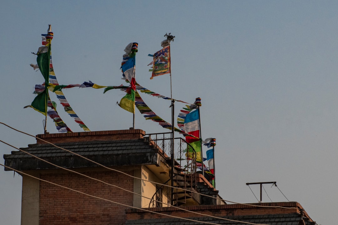 a group of flags on a roof