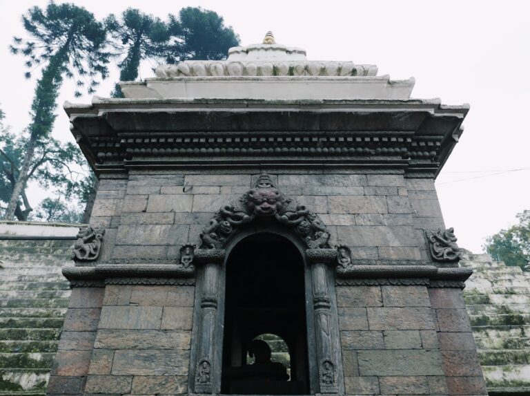 Solo Budget Travel Tips for Visiting Kathmandu β Travel Guide to Kathmandu 17 a stone building with a large archway