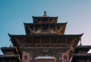 a tall building with a clock on the front of it