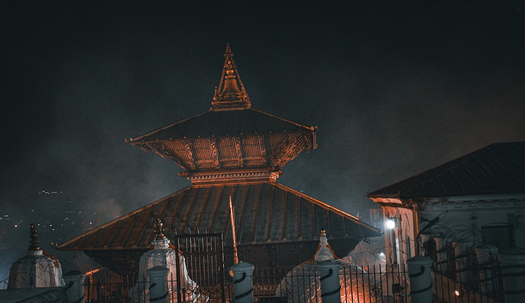 a tall building with a clock on the top of it