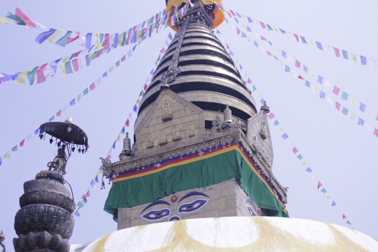 Budget Food Guide: Cheap Eats in Kathmandu β Travel Guide to Kathmandu 101 a very tall building with a very colorful decoration on top of it