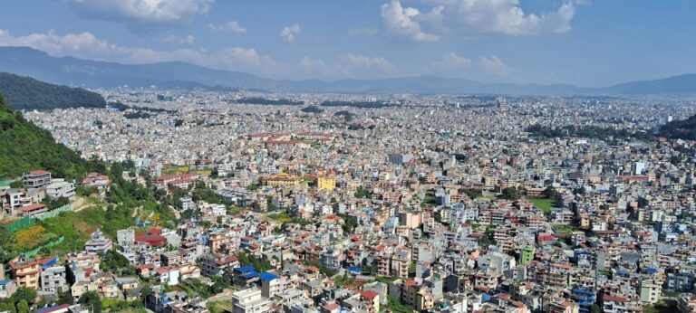 How to Reduce Your Carbon Footprint While Traveling in Kathmandu β Travel Guide to Kathmandu 1 a view of a city from a high point of view