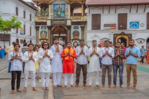 A group of people standing in front of a building