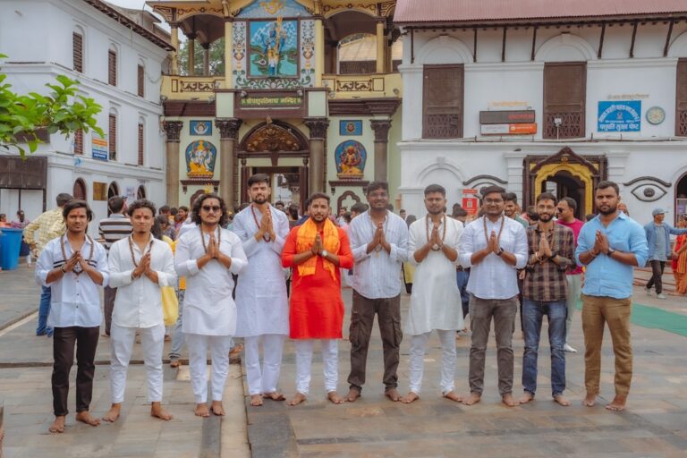 A group of people standing in front of a building