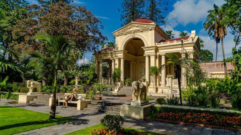 A large building with a fountain in front of it