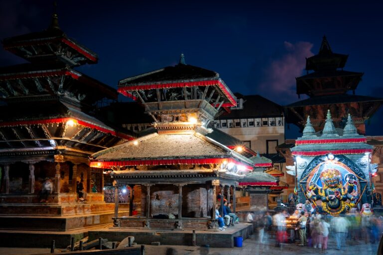A group of people that are standing in front of a building