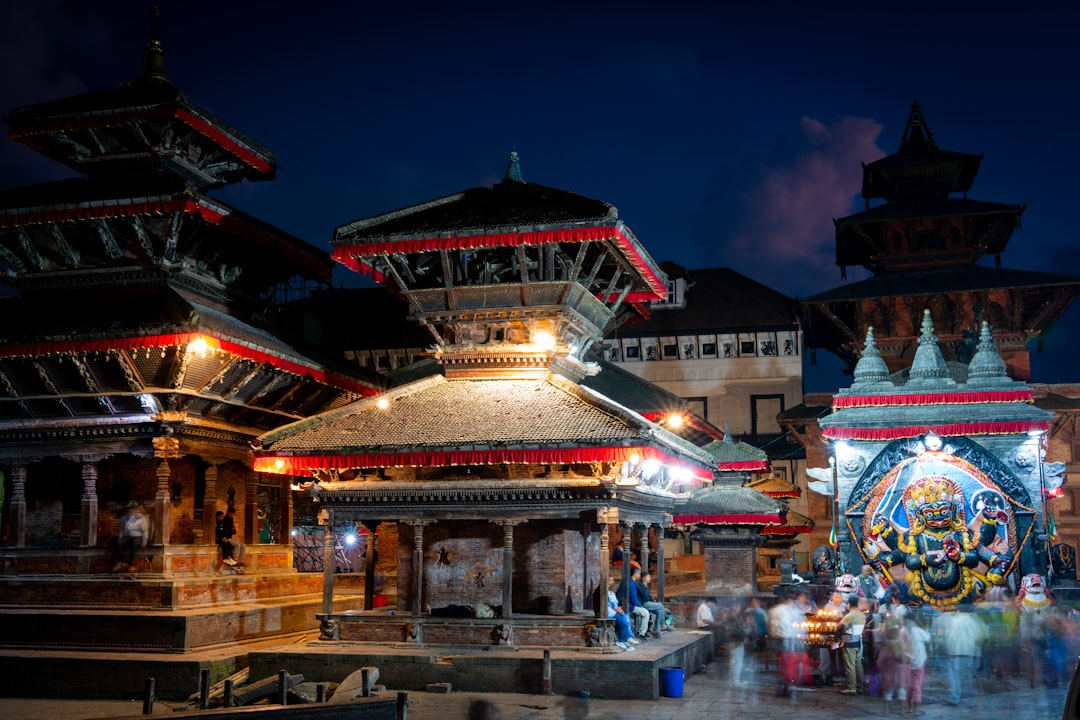 A group of people that are standing in front of a building