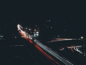 A city street at night with a red light