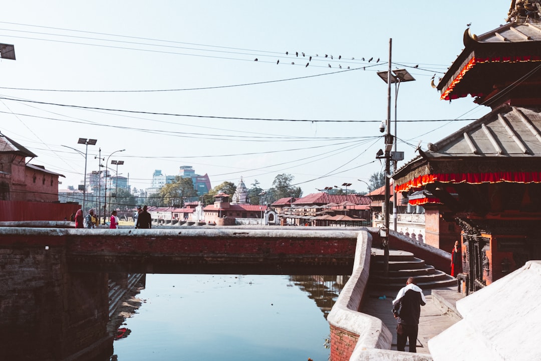 A river running through a city next to a bridge