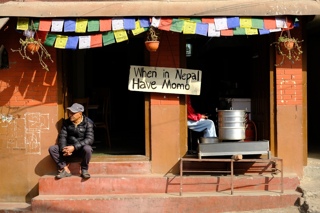 A restaurant in nepal with someone outside.