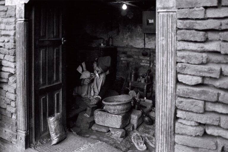 Three-Day Walking Itinerary: Uncover the Real Kathmandu β Travel Guide to Kathmandu 18 A darkened room shows a person working.