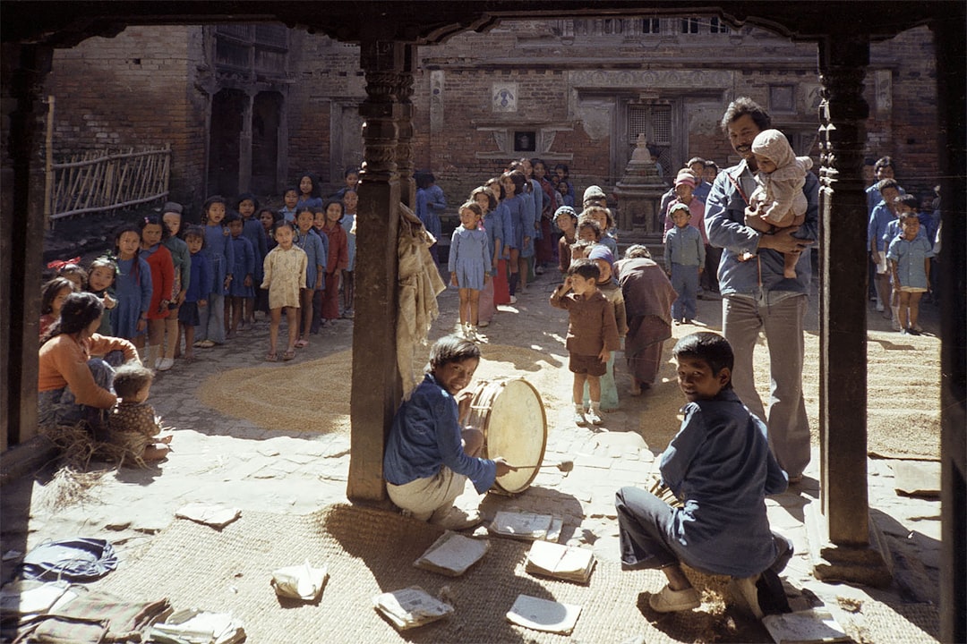 Children are gathered in a courtyard.