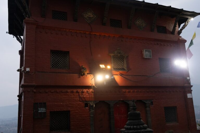 Top 20 Museums and Galleries in Kathmandu β Travel Guide to Kathmandu 66 A tall brick building glows in the sunlight.